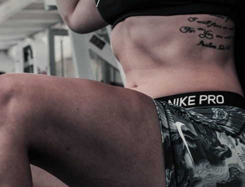 woman wearing gray and white Nike Pro shorts